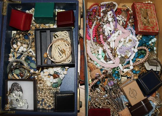 Two boxes of mixed costume jewellery.
